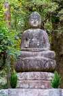 Seated stone Buddha on the grounds of Ryoanji Temple, Kyoto, Japan Art Print